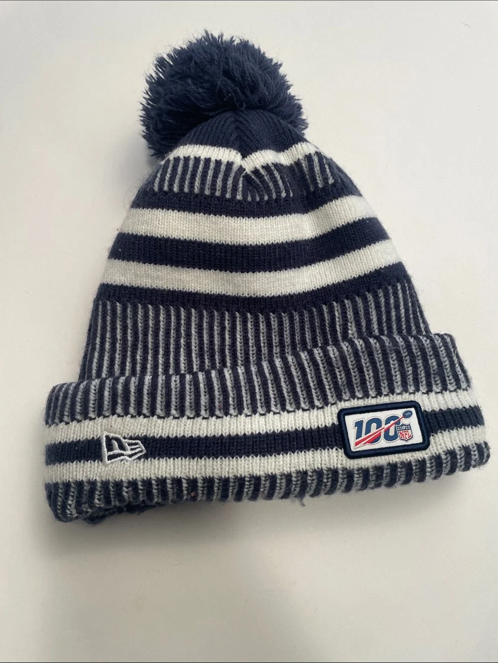 New Era Navy and White Striped Pom Beanie for the Youth